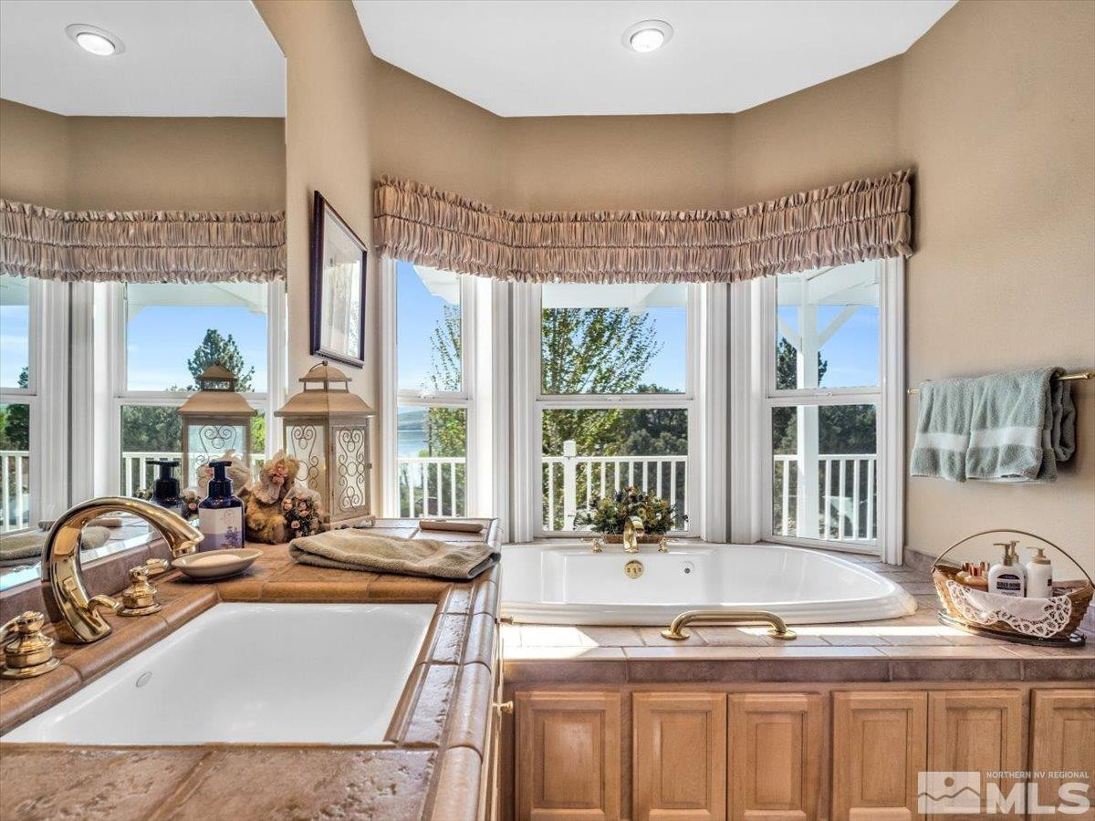2034 Comstock Drive Gardnerville, NV 89410 - Photo 16 of 40 a view of a kitchen with granite countertop a sink and a counter top space