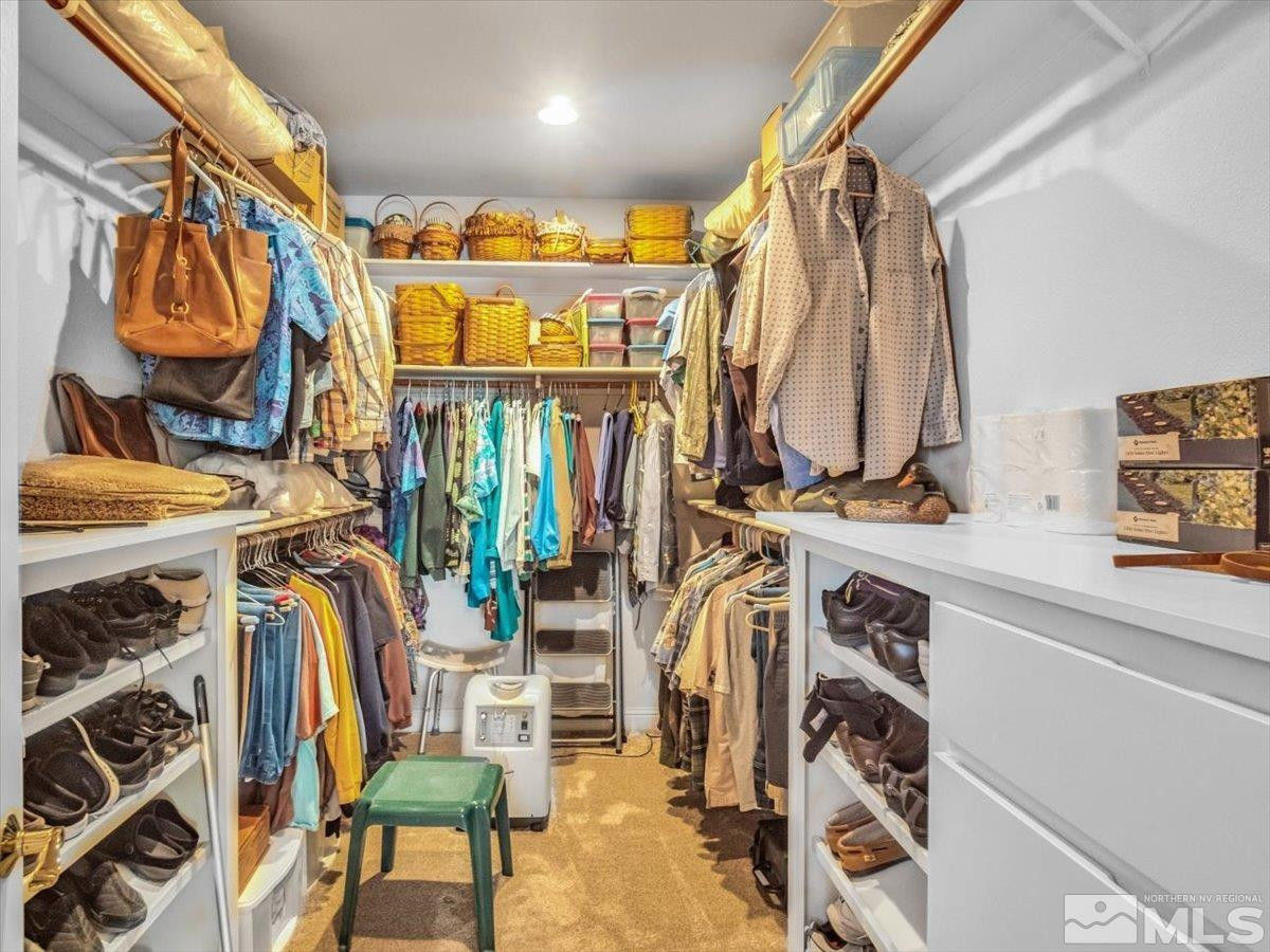 2034 Comstock Drive Gardnerville, NV 89410 - Photo 20 of 40 a view of walk in closet with clothes and shoes