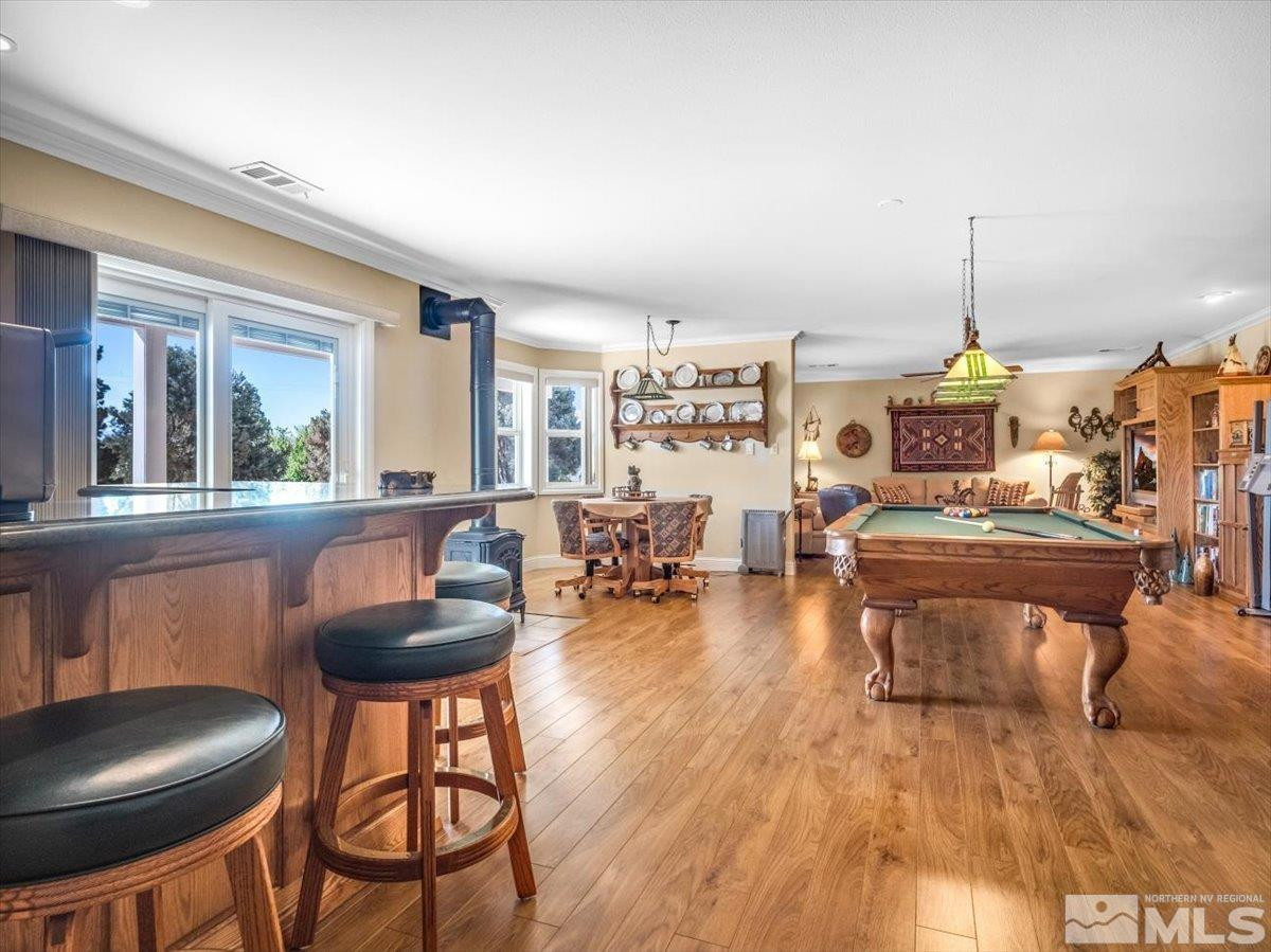 2034 Comstock Drive Gardnerville, NV 89410 - Photo 25 of 40 a dining room with furniture and wooden floor