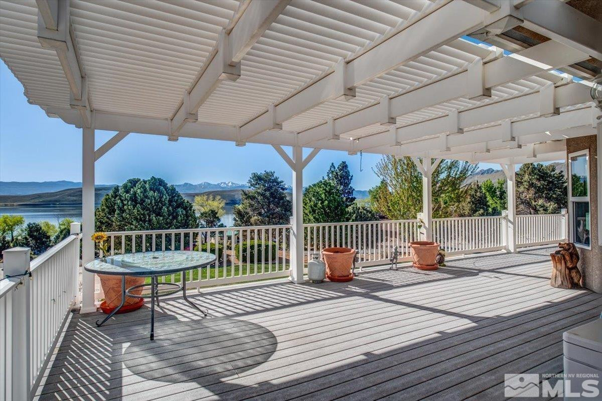 2034 Comstock Drive Gardnerville, NV 89410 - Photo 36 of 40 a view of a patio with a table and chairs