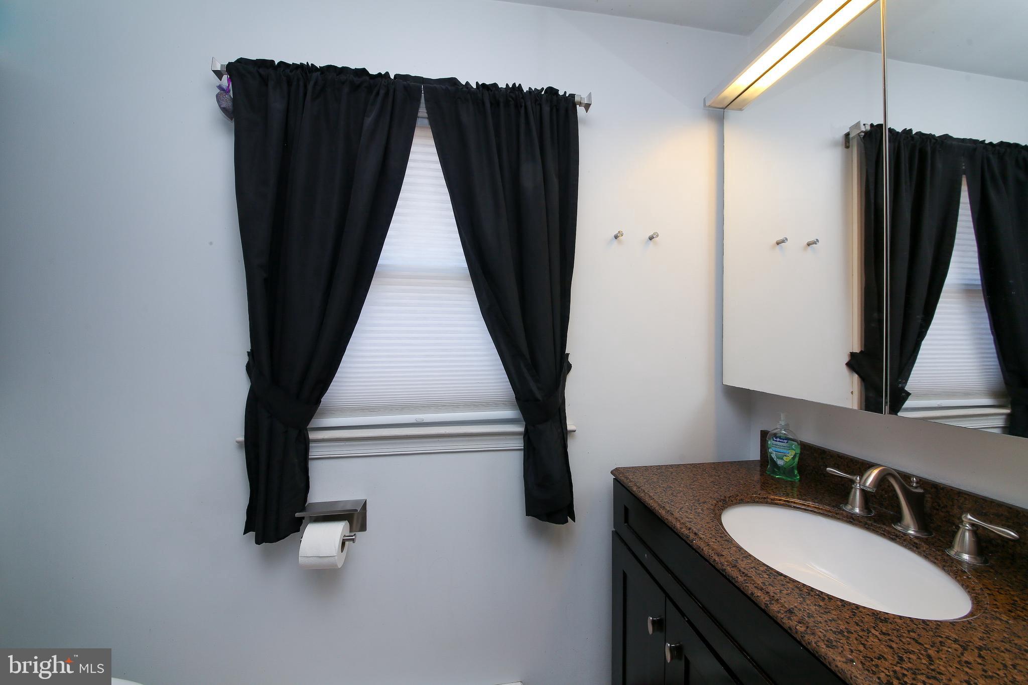 685 Union Road Quakertown, PA 18951 - Photo 18 of 44 a bathroom with a sink a mirror and shower