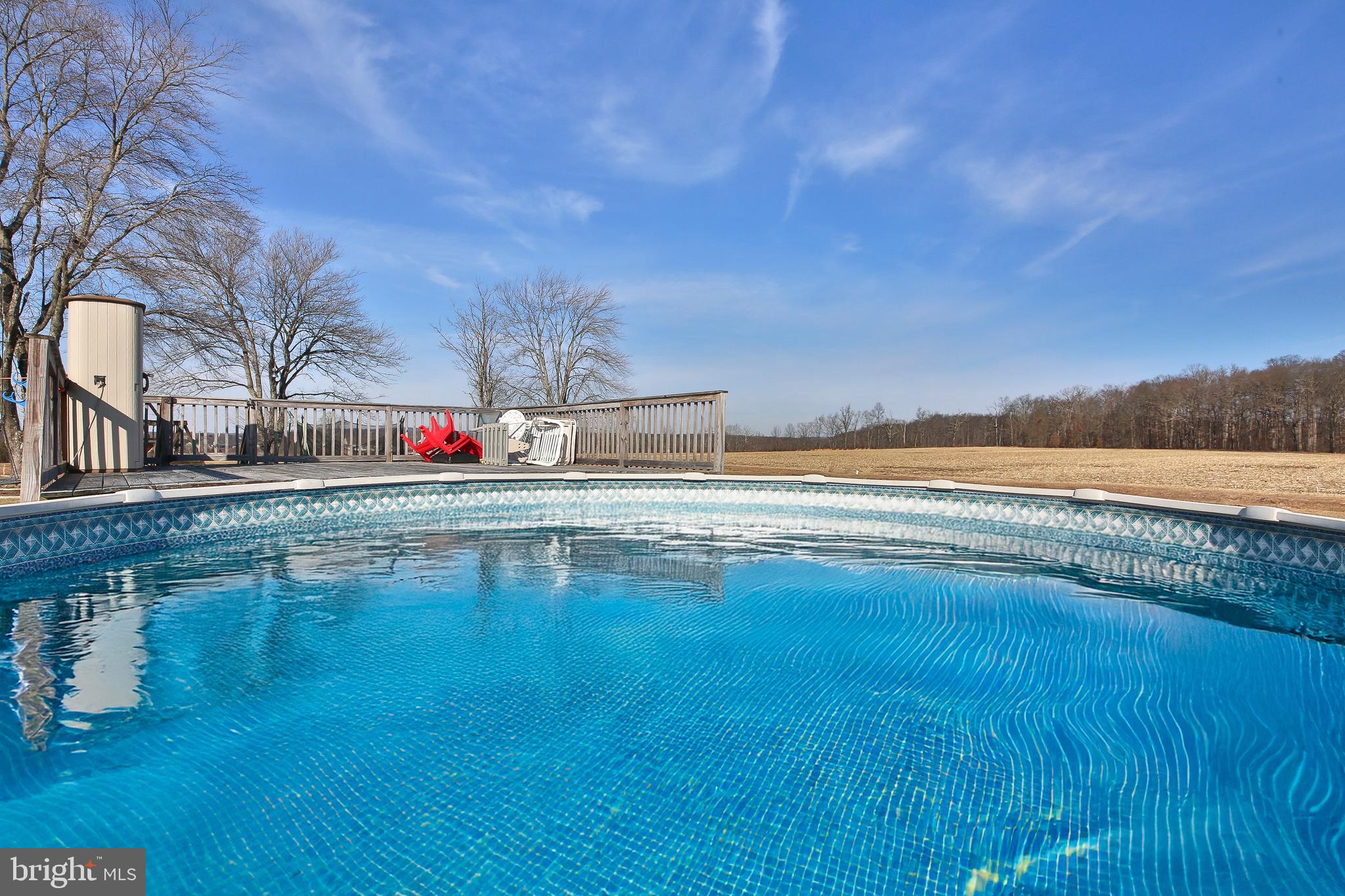 685 Union Road Quakertown, PA 18951 - Photo 29 of 44 a view of pool with ocean and trees in the background