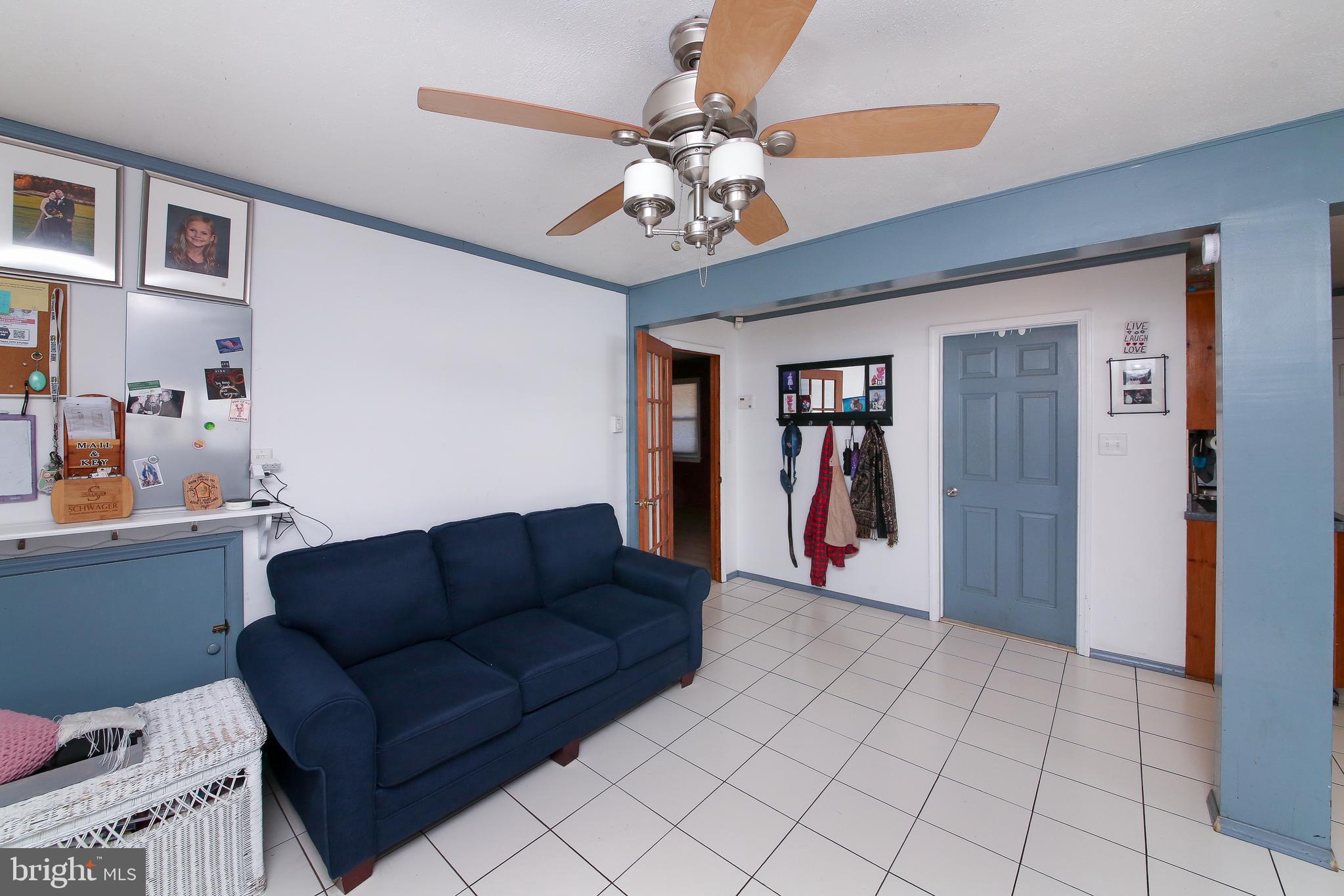 685 Union Road Quakertown, PA 18951 - Photo 8 of 44 a living room with furniture a chandelier and closet
