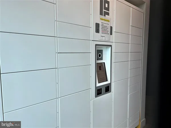 storage and utility room with washer and dryer