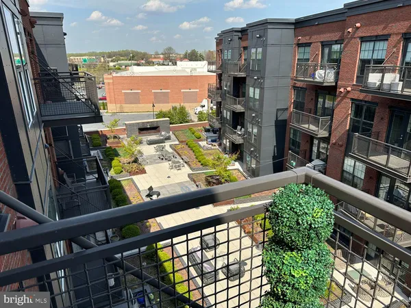 a view of a balcony with chairs