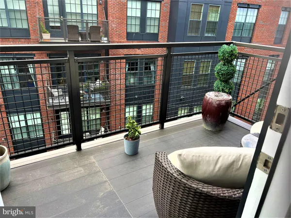 a view of outdoor sitting area in front of a building
