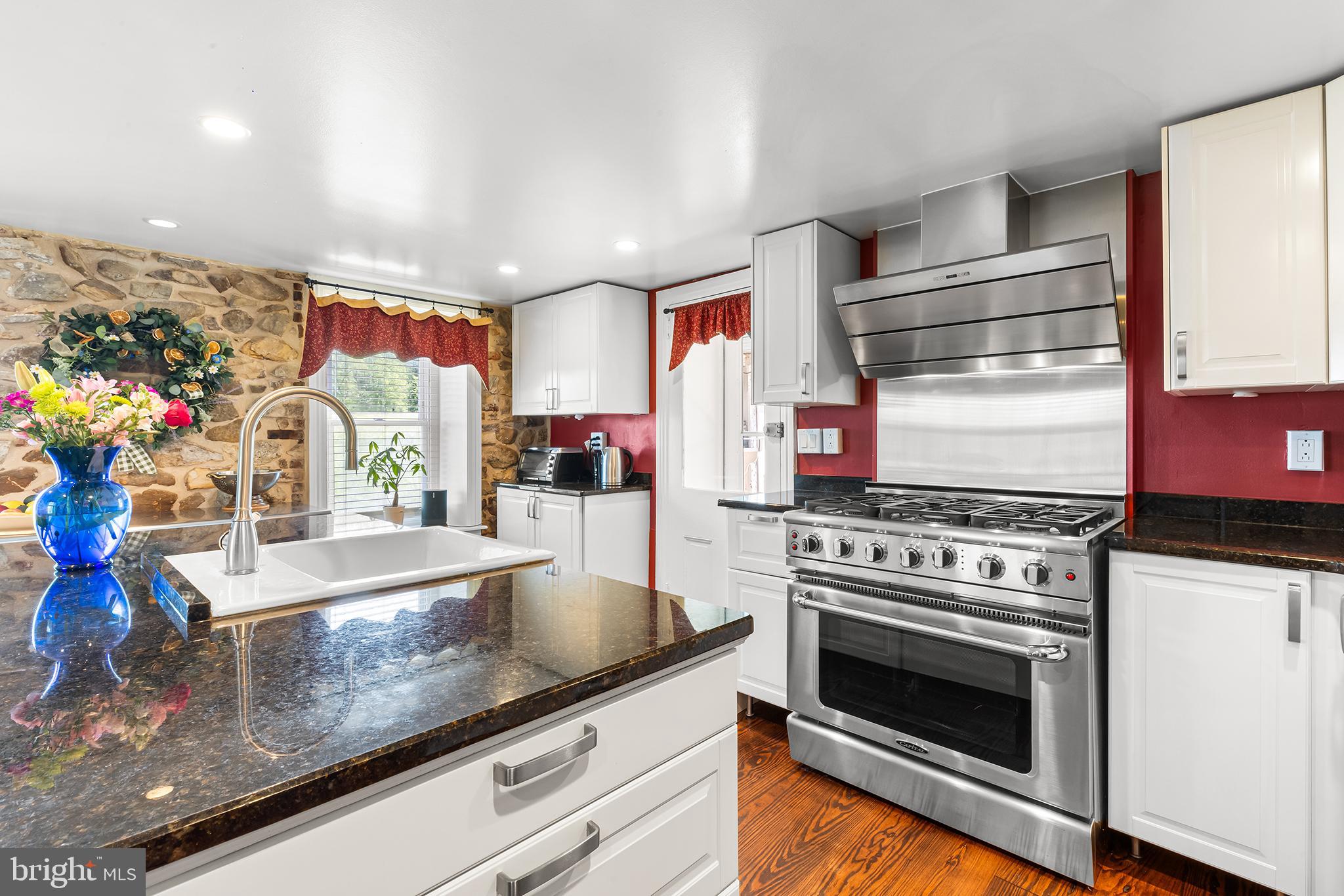 3047 Yellow Springs Road Malvern, PA 19355 - Photo 18 of 68 a kitchen with stainless steel appliances granite countertop a stove and a sink