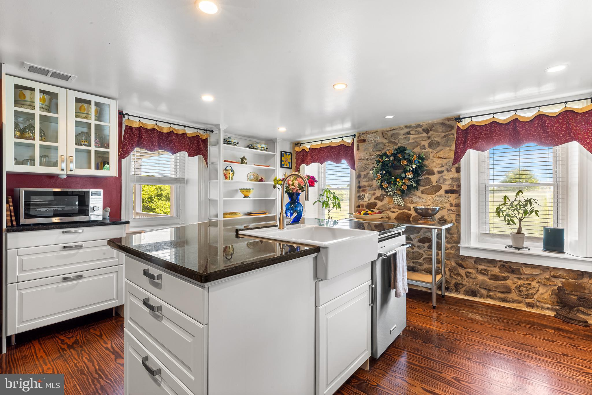 3047 Yellow Springs Road Malvern, PA 19355 - Photo 20 of 68 a kitchen that has a lot of cabinets in it and wooden floor