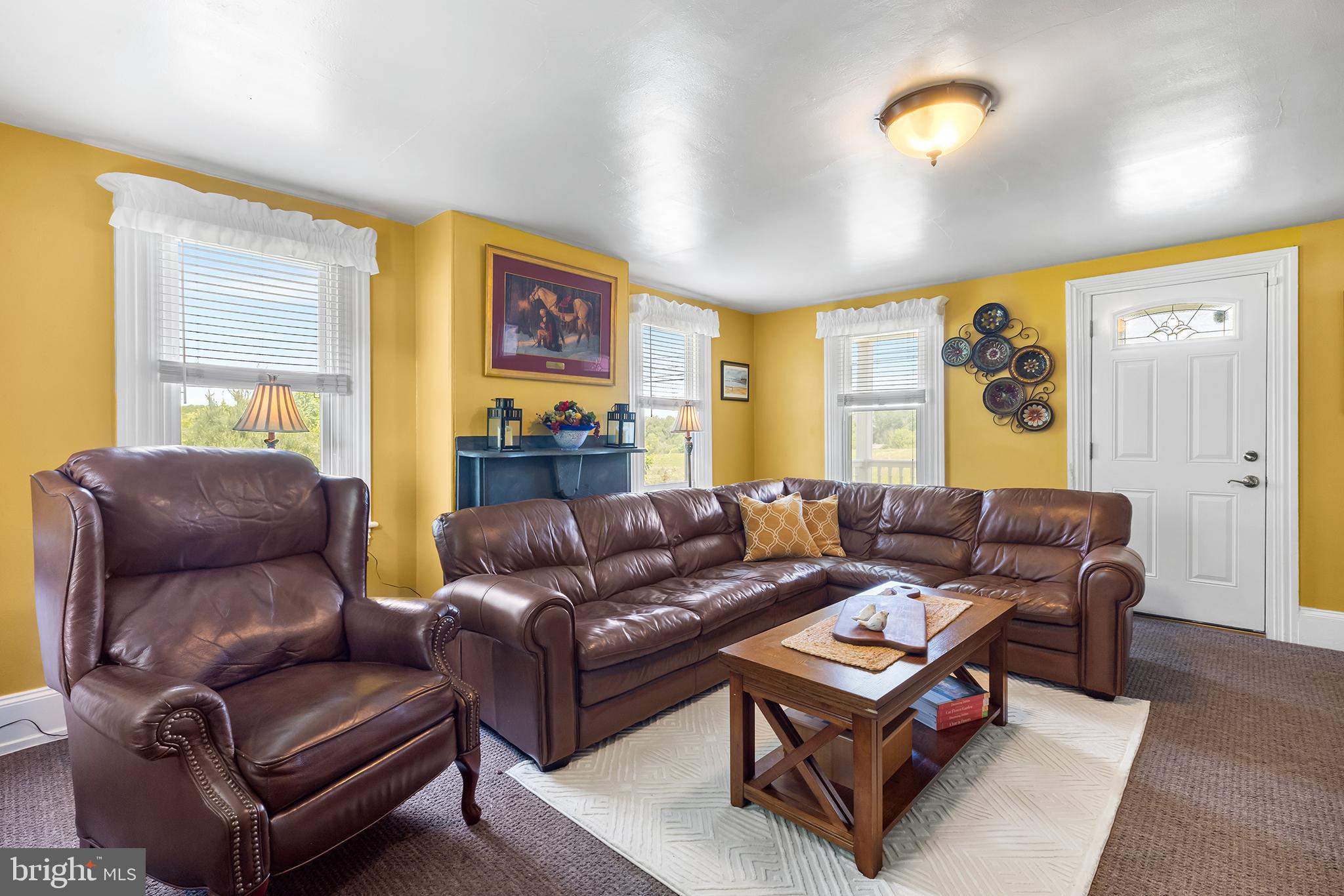 3047 Yellow Springs Road Malvern, PA 19355 - Photo 23 of 68 a living room with furniture a flat screen tv and a window