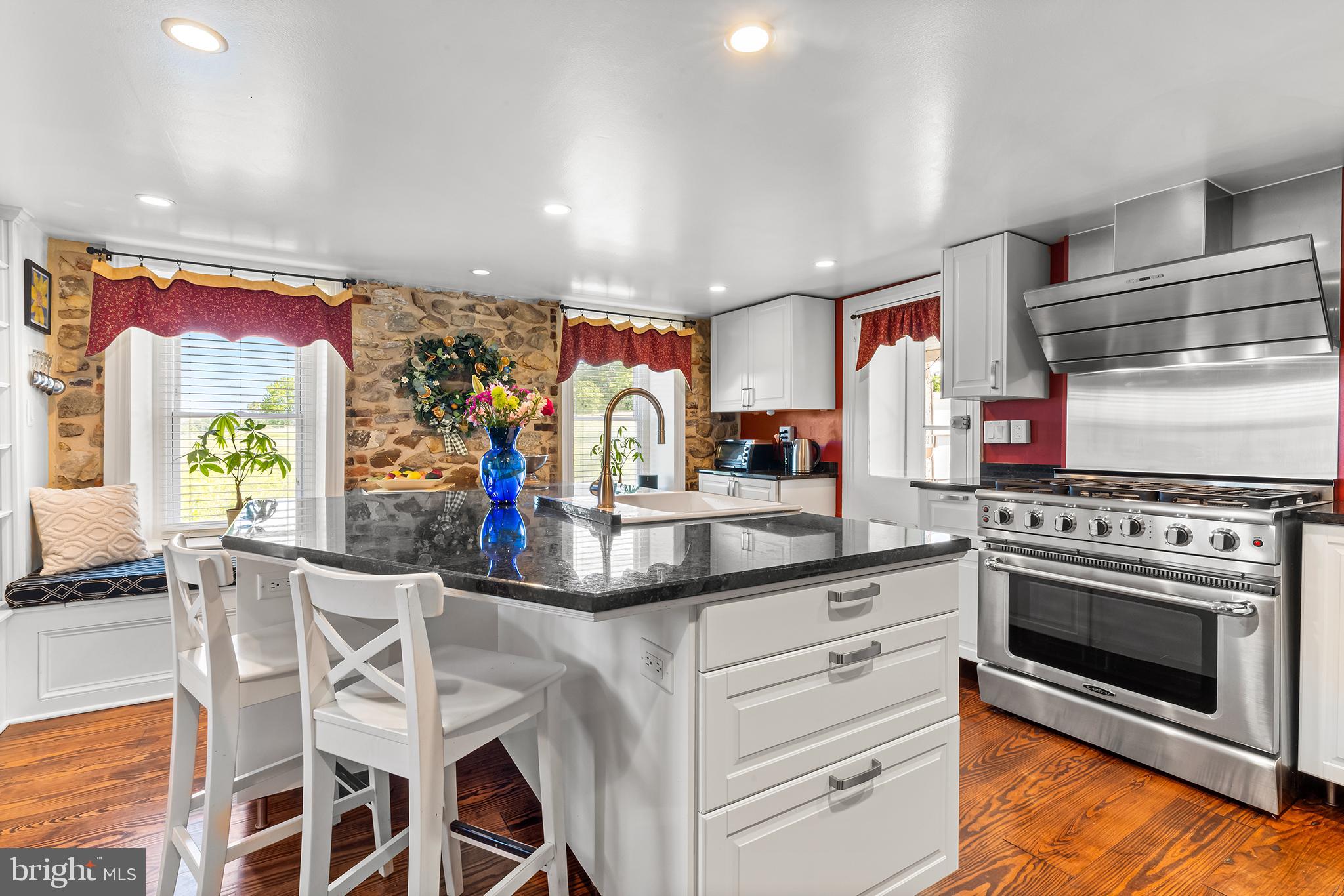 3047 Yellow Springs Road Malvern, PA 19355 - Photo 3 of 68 a kitchen with stainless steel appliances granite countertop a stove and cabinets