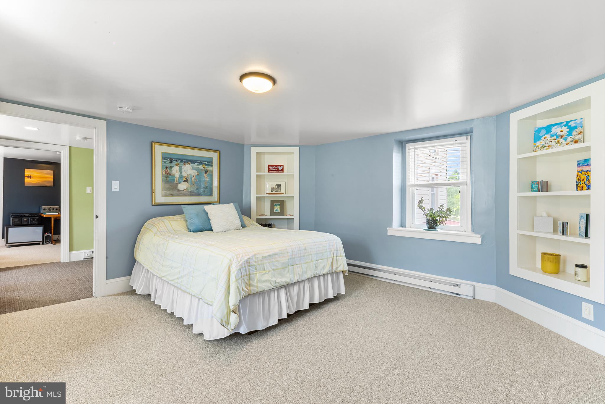 3047 Yellow Springs Road Malvern, PA 19355 - Photo 31 of 68 a spacious bedroom with a bed and a window
