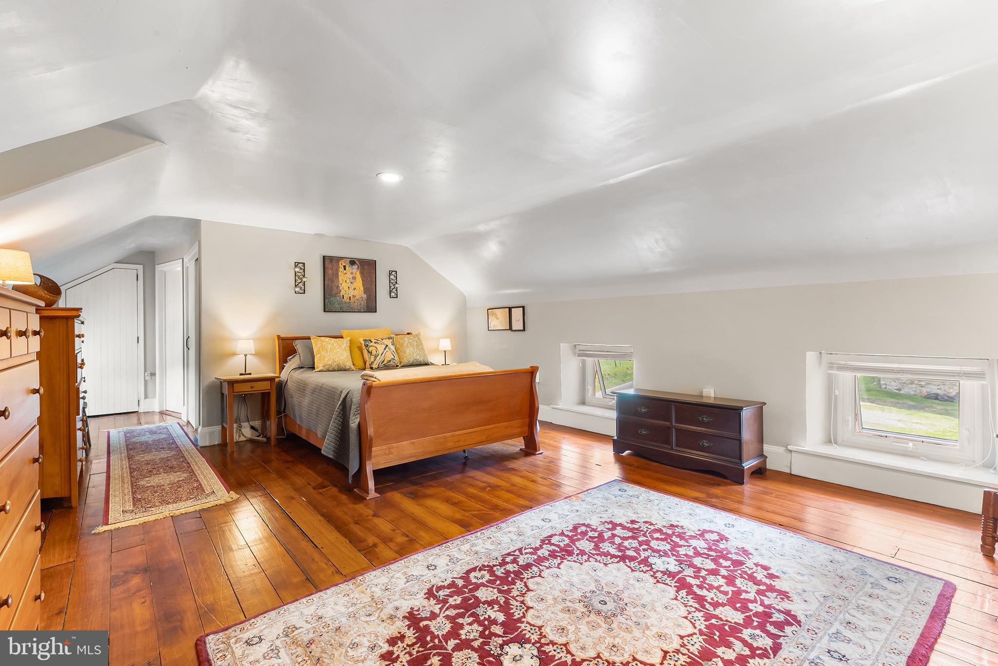 3047 Yellow Springs Road Malvern, PA 19355 - Photo 38 of 68 a bedroom with a bed and wooden floor
