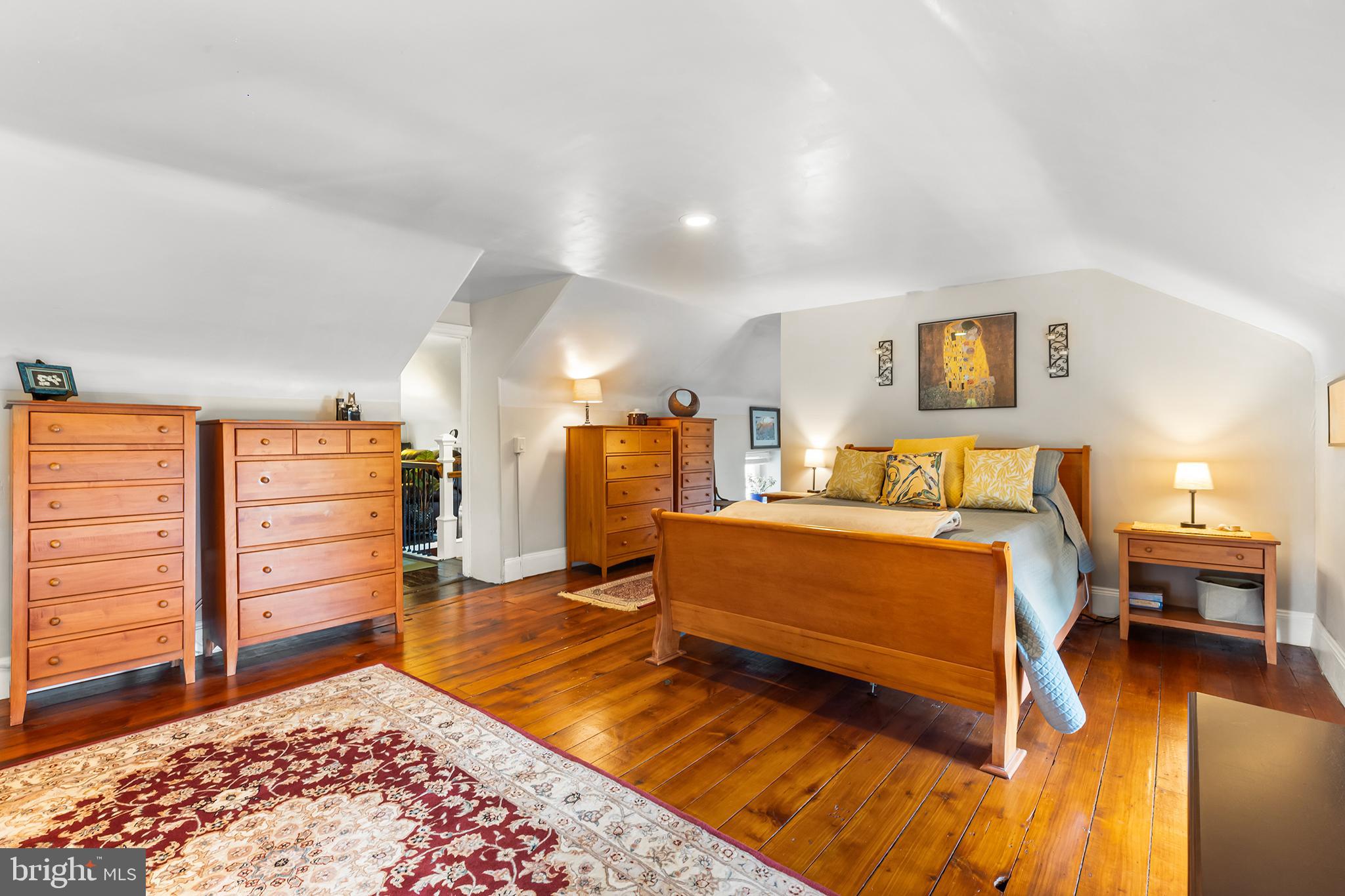 3047 Yellow Springs Road Malvern, PA 19355 - Photo 39 of 68 a bedroom with a bed and wooden floor