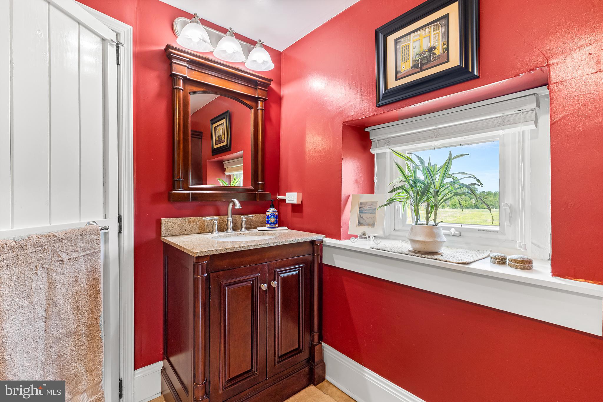 3047 Yellow Springs Road Malvern, PA 19355 - Photo 41 of 68 a bathroom with a granite countertop sink and a large mirror