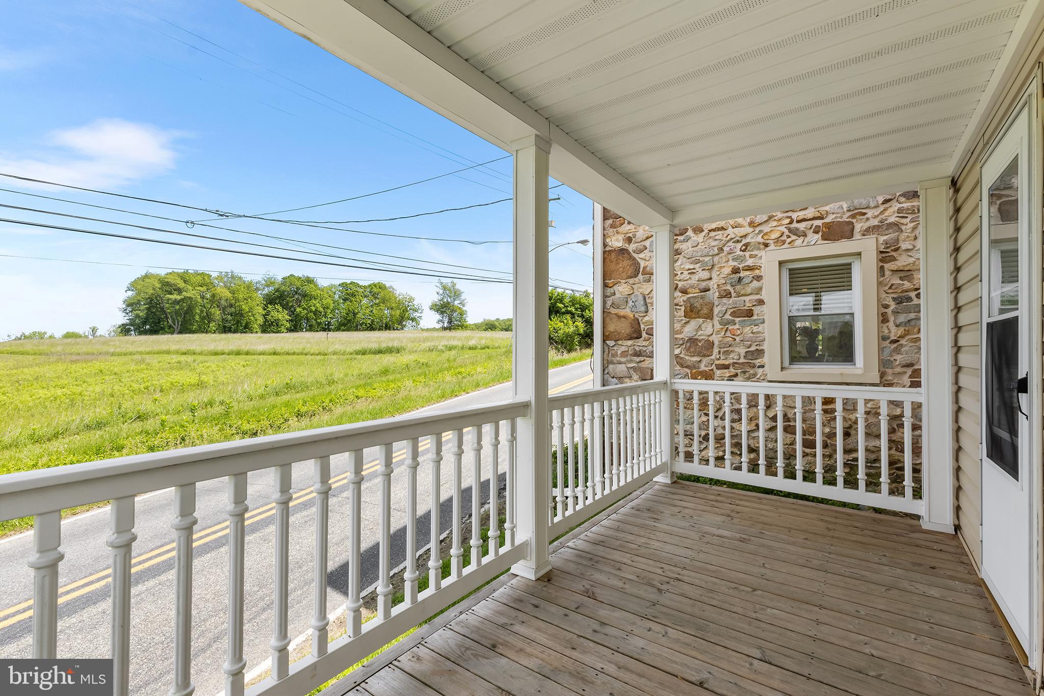 3047 Yellow Springs Road Malvern, PA 19355 - Photo 54 of 68 a view of a porch with wooden floor in front of house
