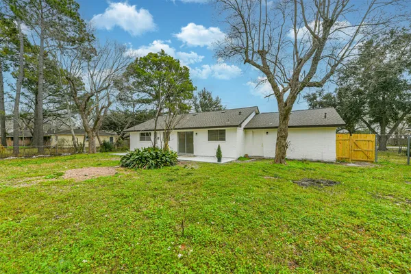 a view of backyard with green space
