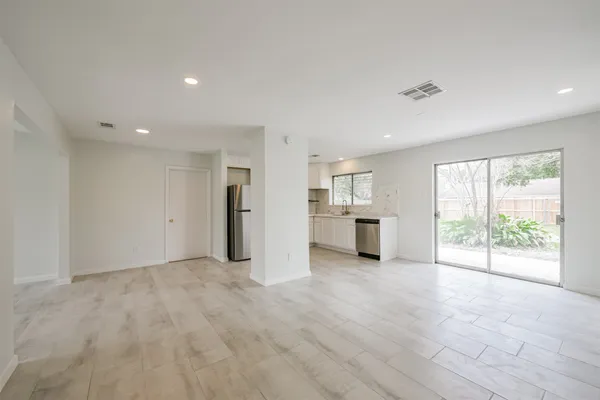 a view of a kitchen with a sink and a window