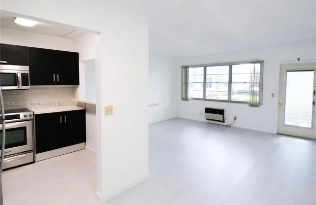 a view of a kitchen with microwave and stove