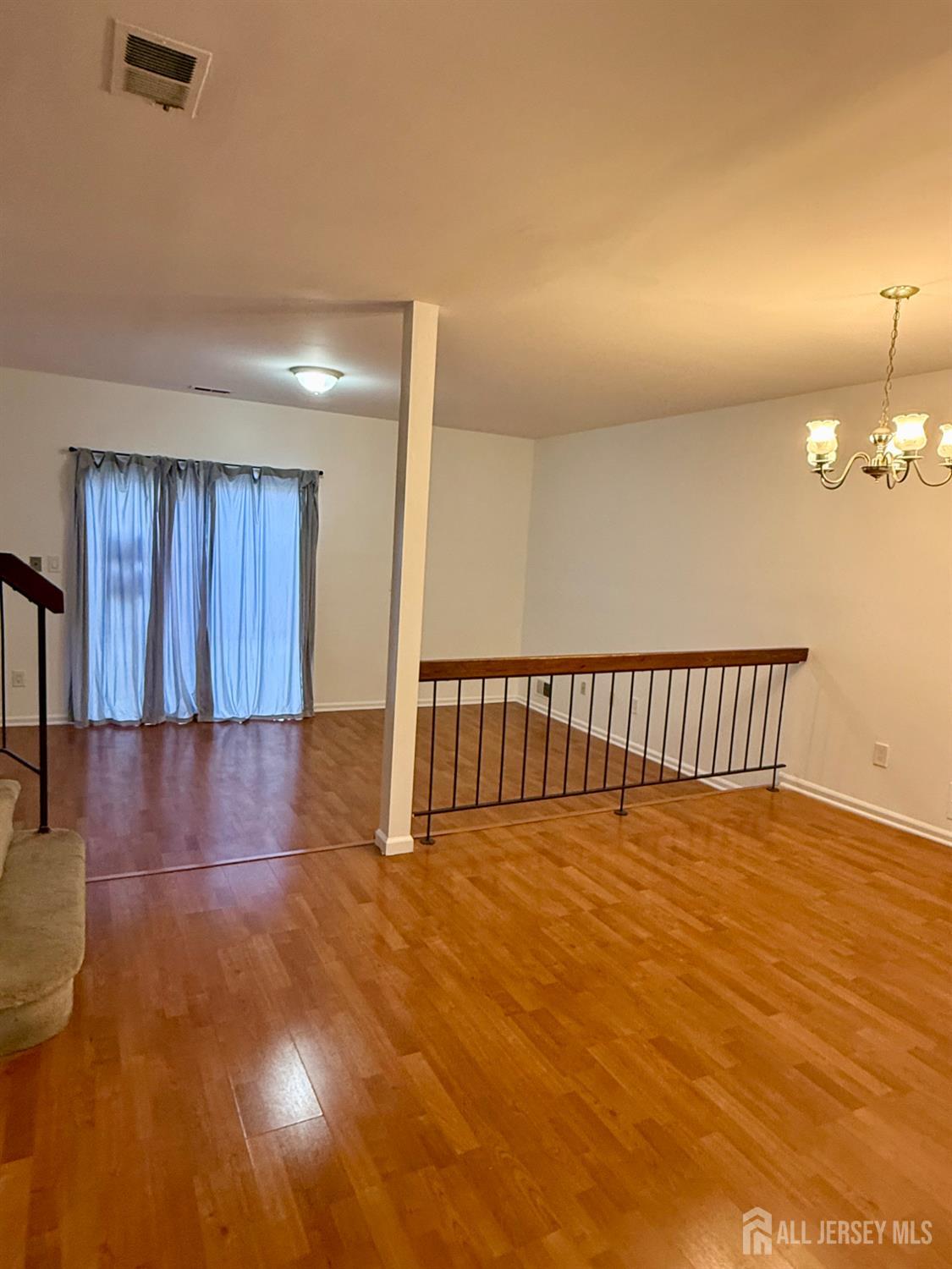 405 Maplecrest Road Edison, NJ 08820 - Photo 3 of 13 a view of a room with wooden floor