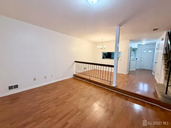 a view of a hallway with a room