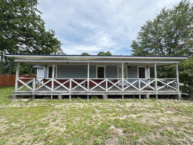 5716 Camden Road Fayetteville, NC 28306 - Photo 4 of 10 an outdoor space with wooden roof and deck