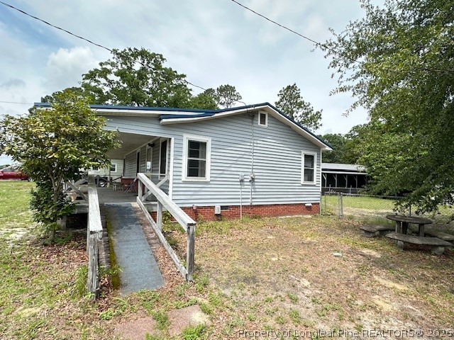 5716 Camden Road Fayetteville, NC 28306 - Photo 5 of 10 a house view with a outdoor space