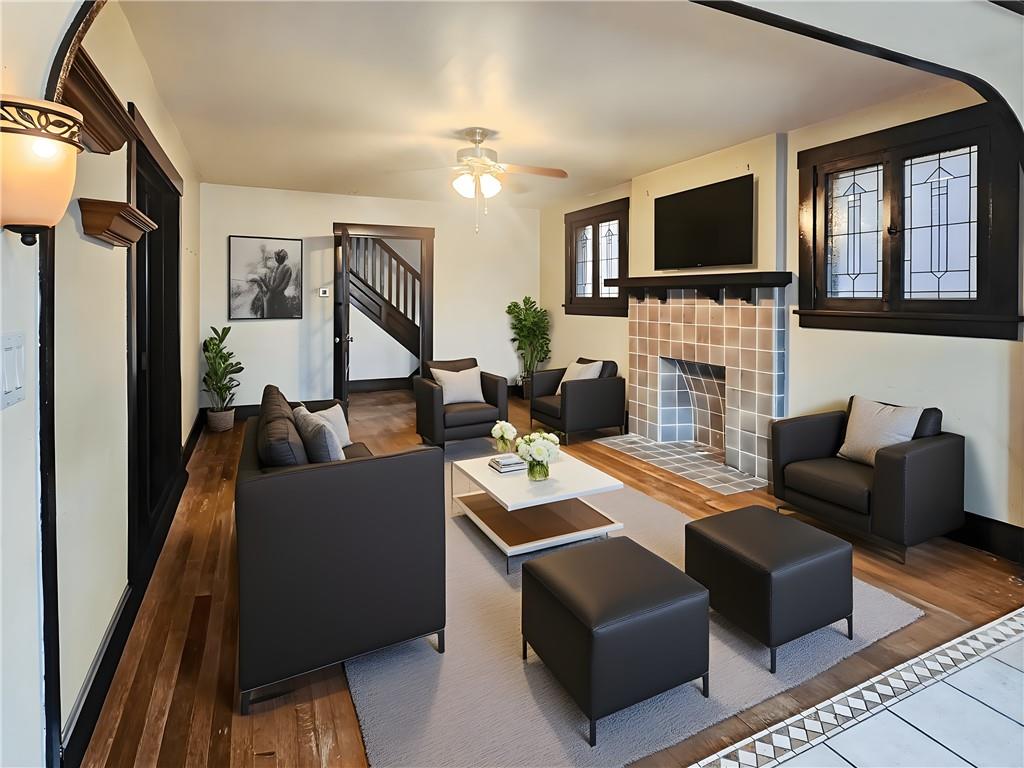 3254 Wainbell Avenue Pittsburgh, PA 15216 - Photo 4 of 11 a living room with fireplace furniture and a flat screen tv