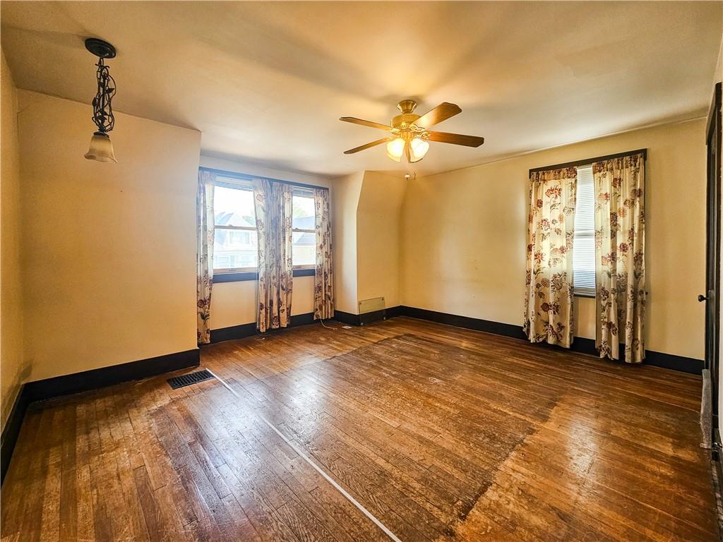 3254 Wainbell Avenue Pittsburgh, PA 15216 - Photo 5 of 11 wooden floor in an empty room with a window