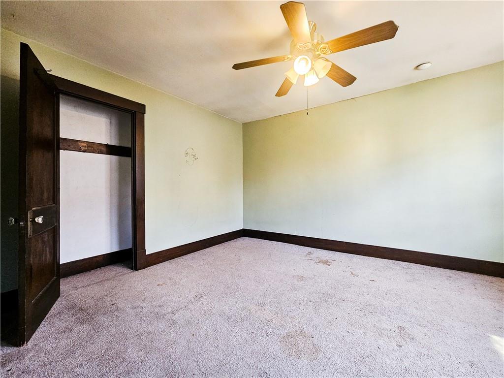 3254 Wainbell Avenue Pittsburgh, PA 15216 - Photo 9 of 11 an empty room with windows and fan