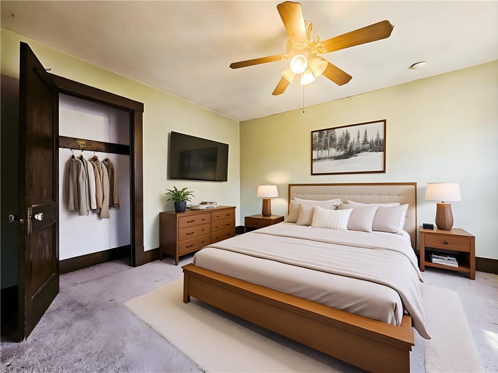 3254 Wainbell Avenue Pittsburgh, PA 15216 - Photo 10 of 11 a spacious bedroom with a bed and a flat screen tv