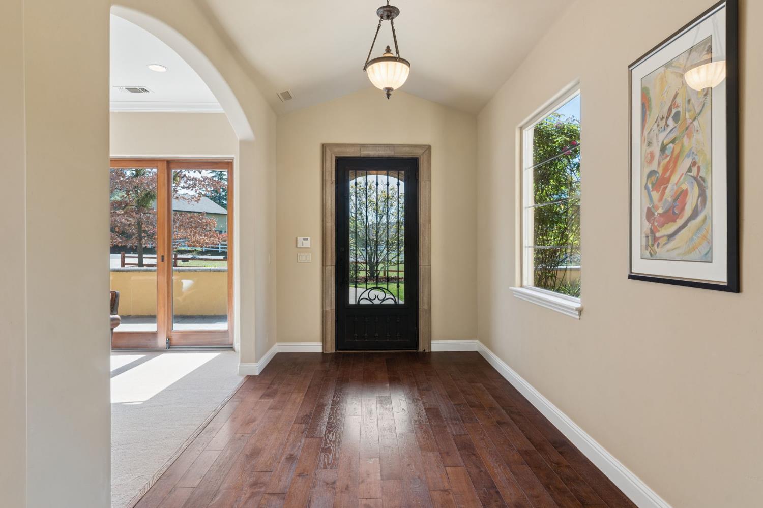 5180 Remuda Court Shingle Springs, CA 95682 - Photo 15 of 88 a view of an empty room with wooden floor and a window