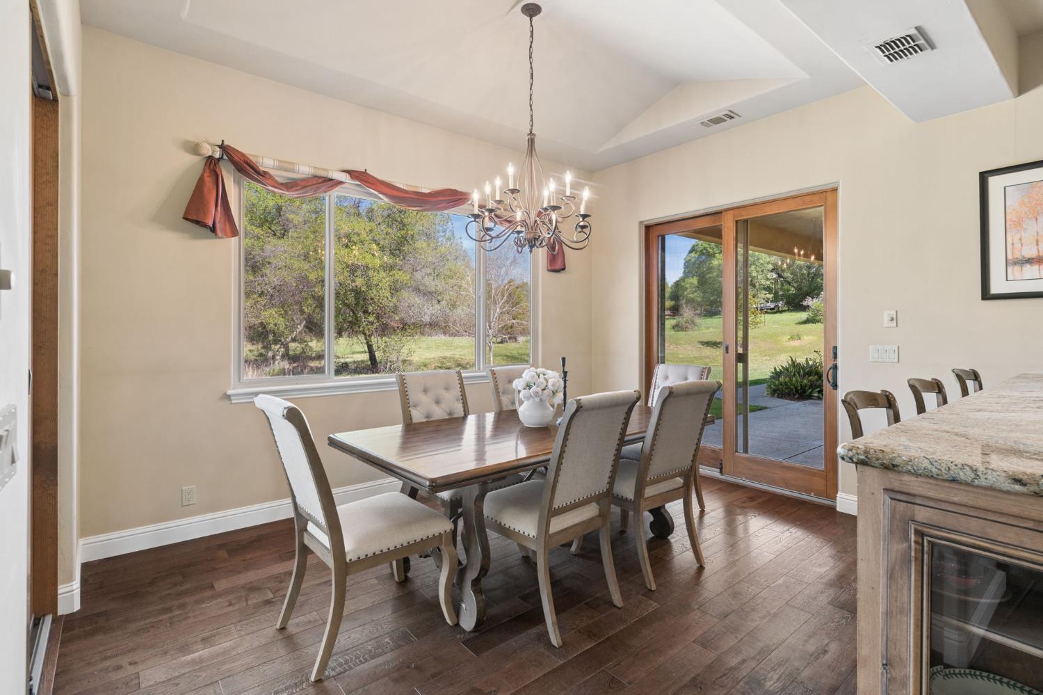 5180 Remuda Court Shingle Springs, CA 95682 - Photo 22 of 88 a view of a dining room with furniture window and wooden floor