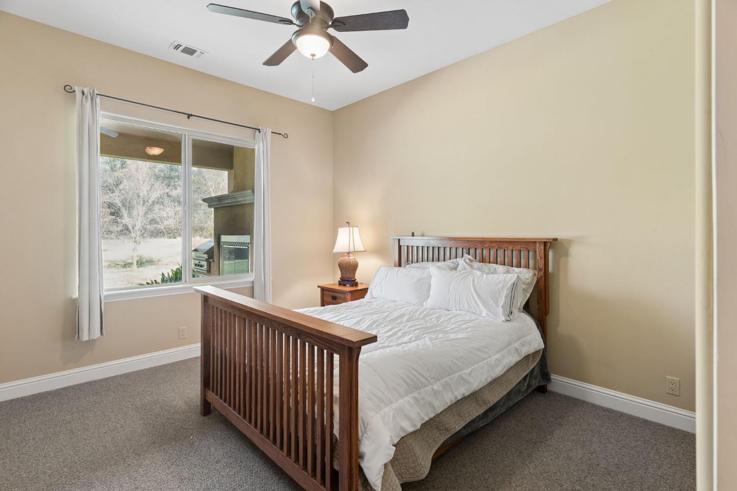 5180 Remuda Court Shingle Springs, CA 95682 - Photo 39 of 88 a bedroom with a bed and window