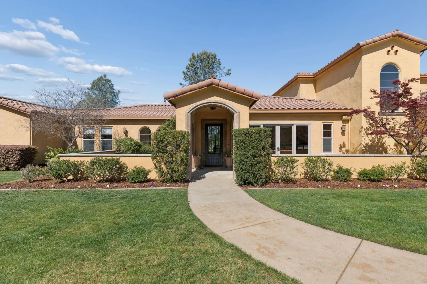 5180 Remuda Court Shingle Springs, CA 95682 - Photo 4 of 88 a front view of a house with a yard