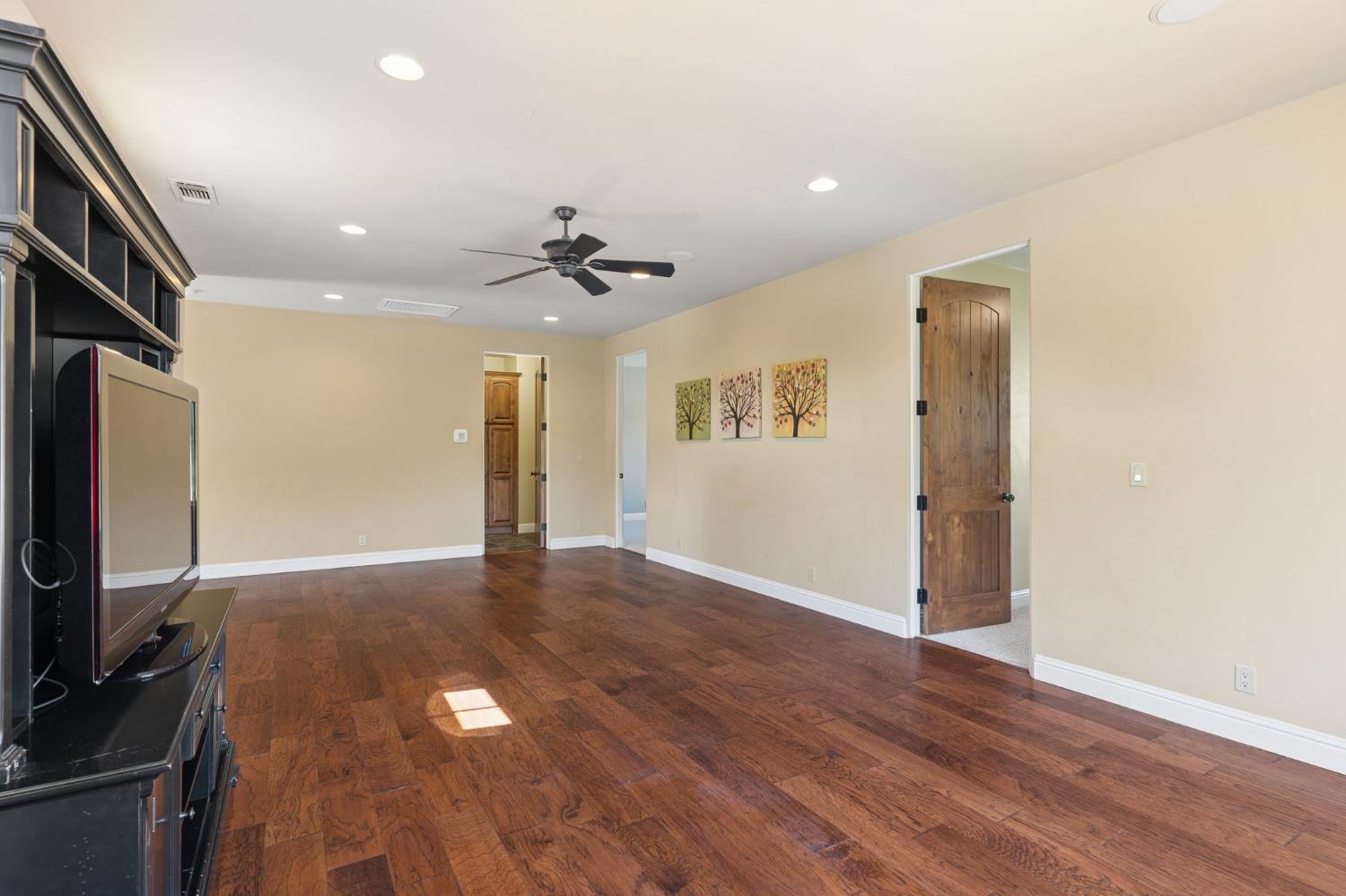 5180 Remuda Court Shingle Springs, CA 95682 - Photo 50 of 88 a view of empty room with wooden floor and fan