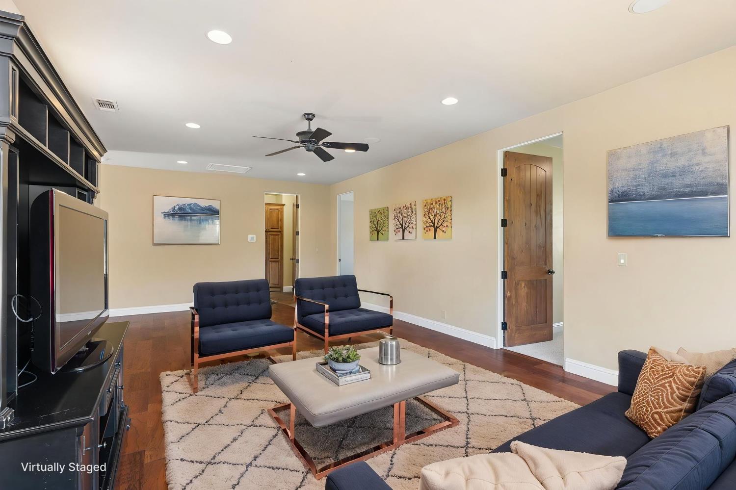 5180 Remuda Court Shingle Springs, CA 95682 - Photo 51 of 88 a living room with furniture and a flat screen tv