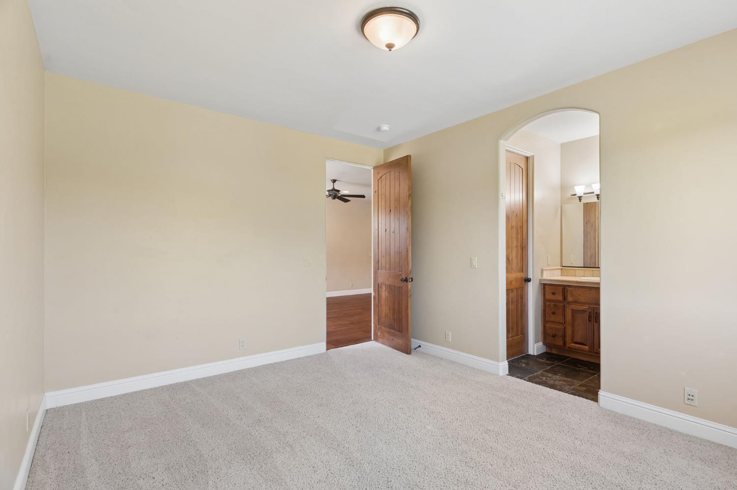 5180 Remuda Court Shingle Springs, CA 95682 - Photo 53 of 88 an empty room with closet and mirror