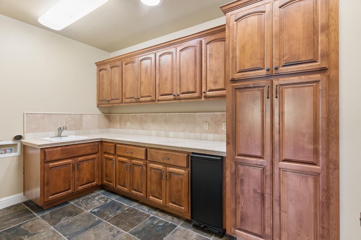5180 Remuda Court Shingle Springs, CA 95682 - Photo 58 of 88 a kitchen with a sink and cabinets