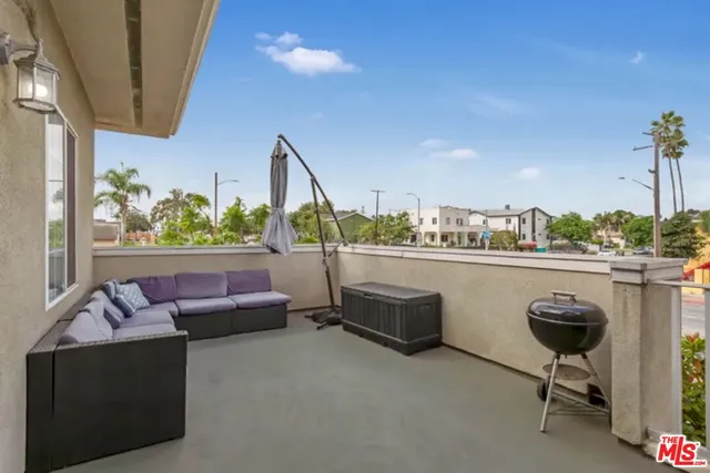 a outdoor living space with furniture and city view