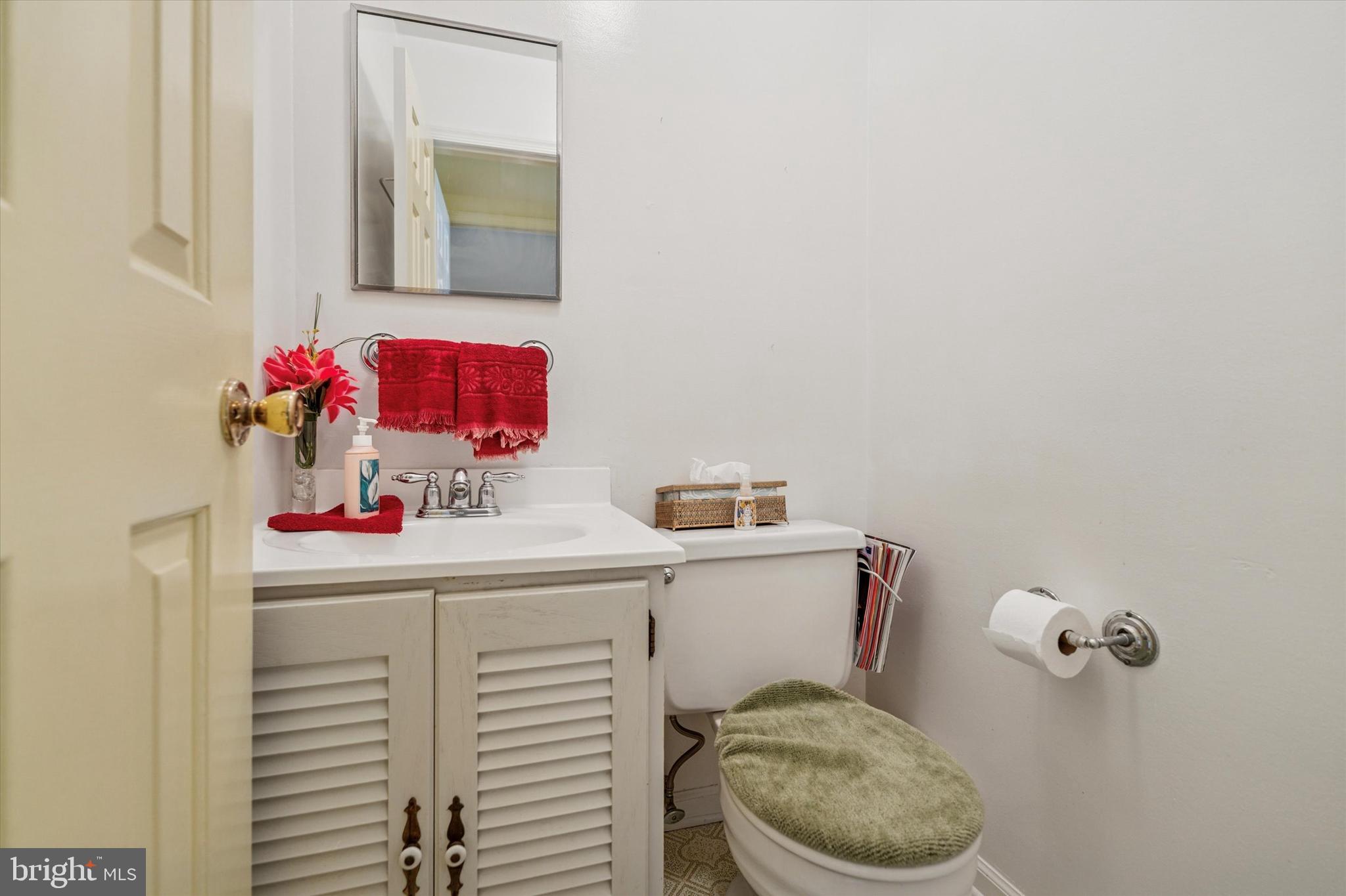 515 Conway Avenue Narberth, PA 19072 - Photo 12 of 27 a bathroom with a toilet sink vanity and mirror