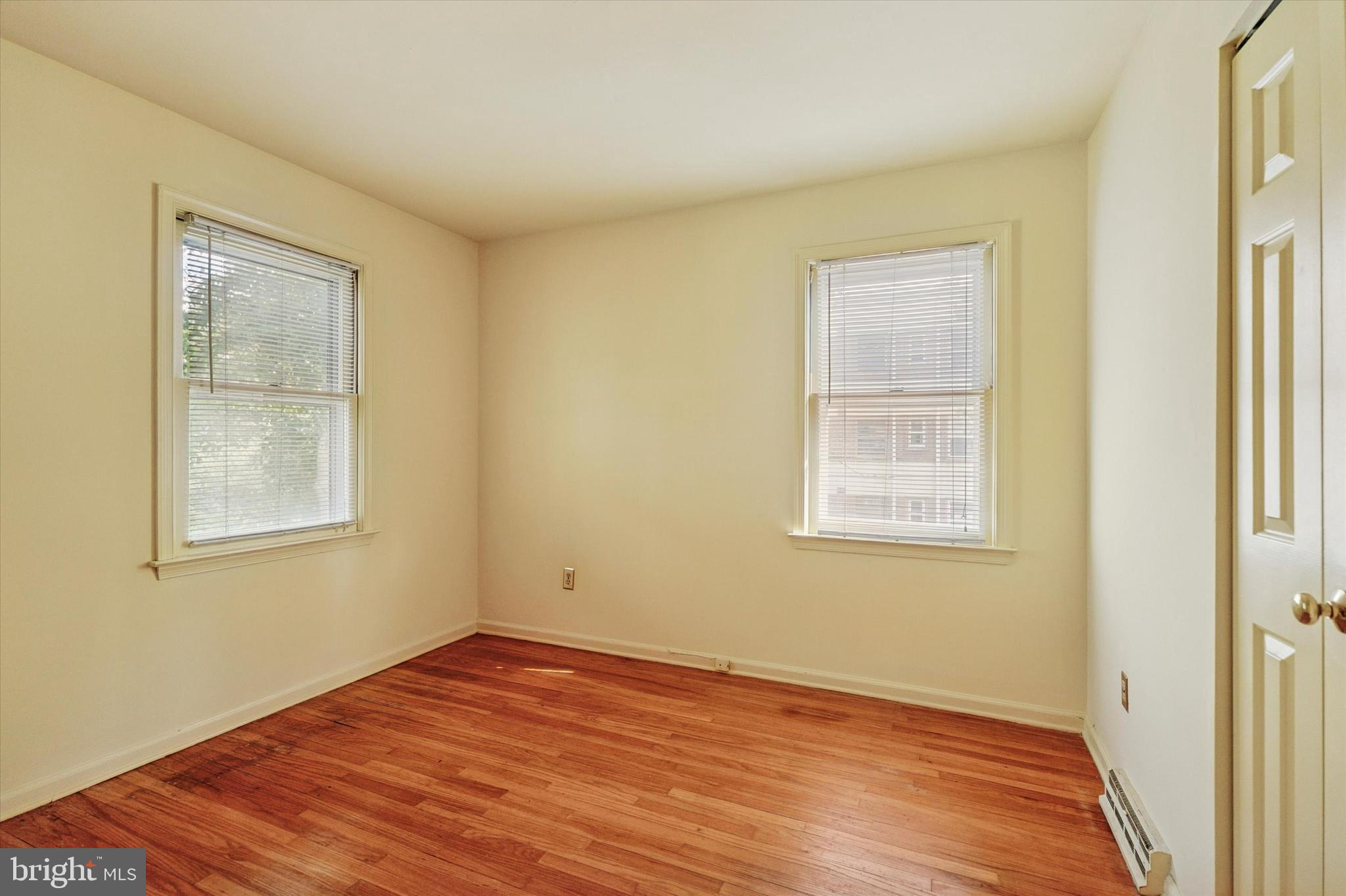 515 Conway Avenue Narberth, PA 19072 - Photo 13 of 27 a view of an empty room with wooden floor and a window