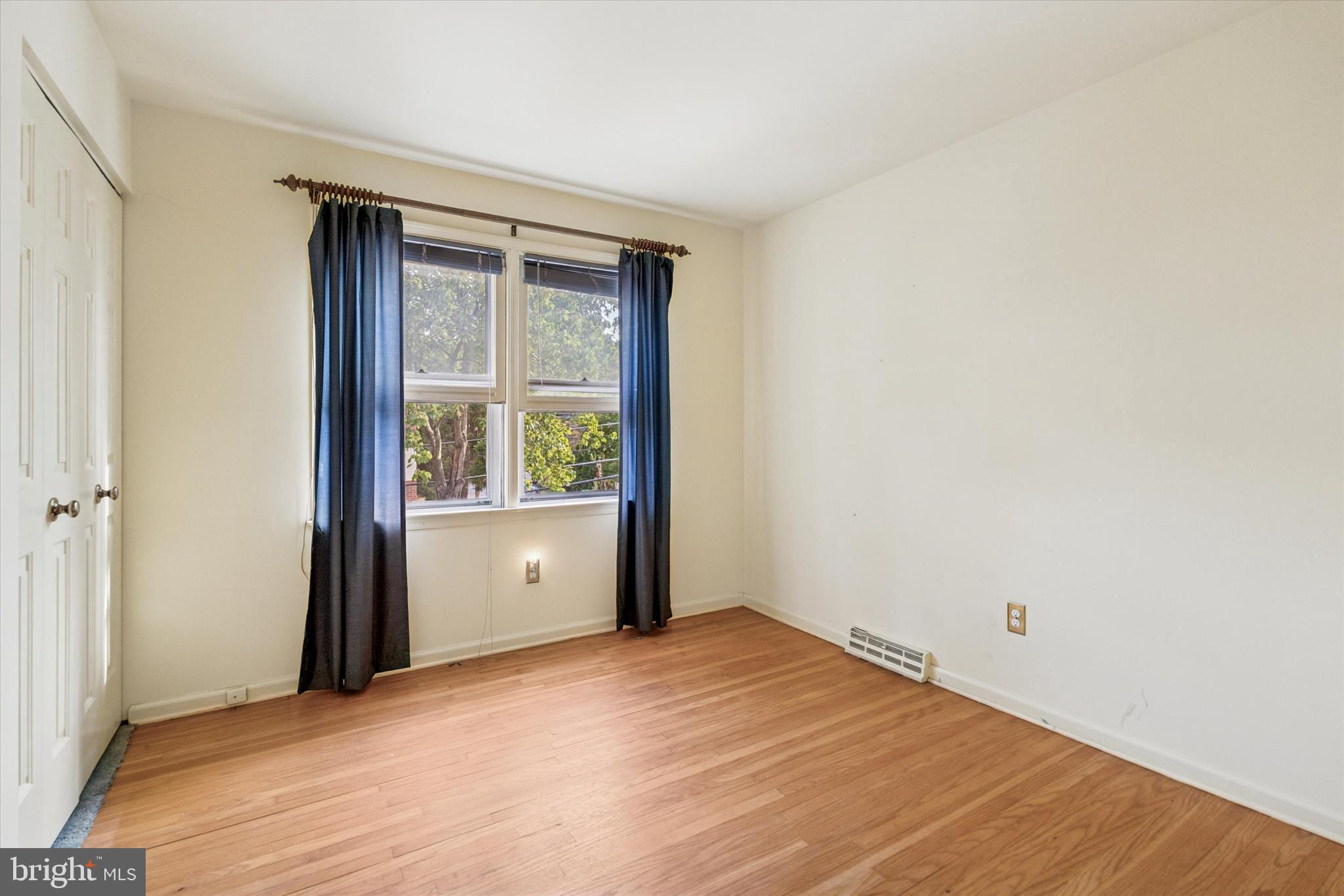 515 Conway Avenue Narberth, PA 19072 - Photo 16 of 27 a view of an empty room with wooden floor and a window