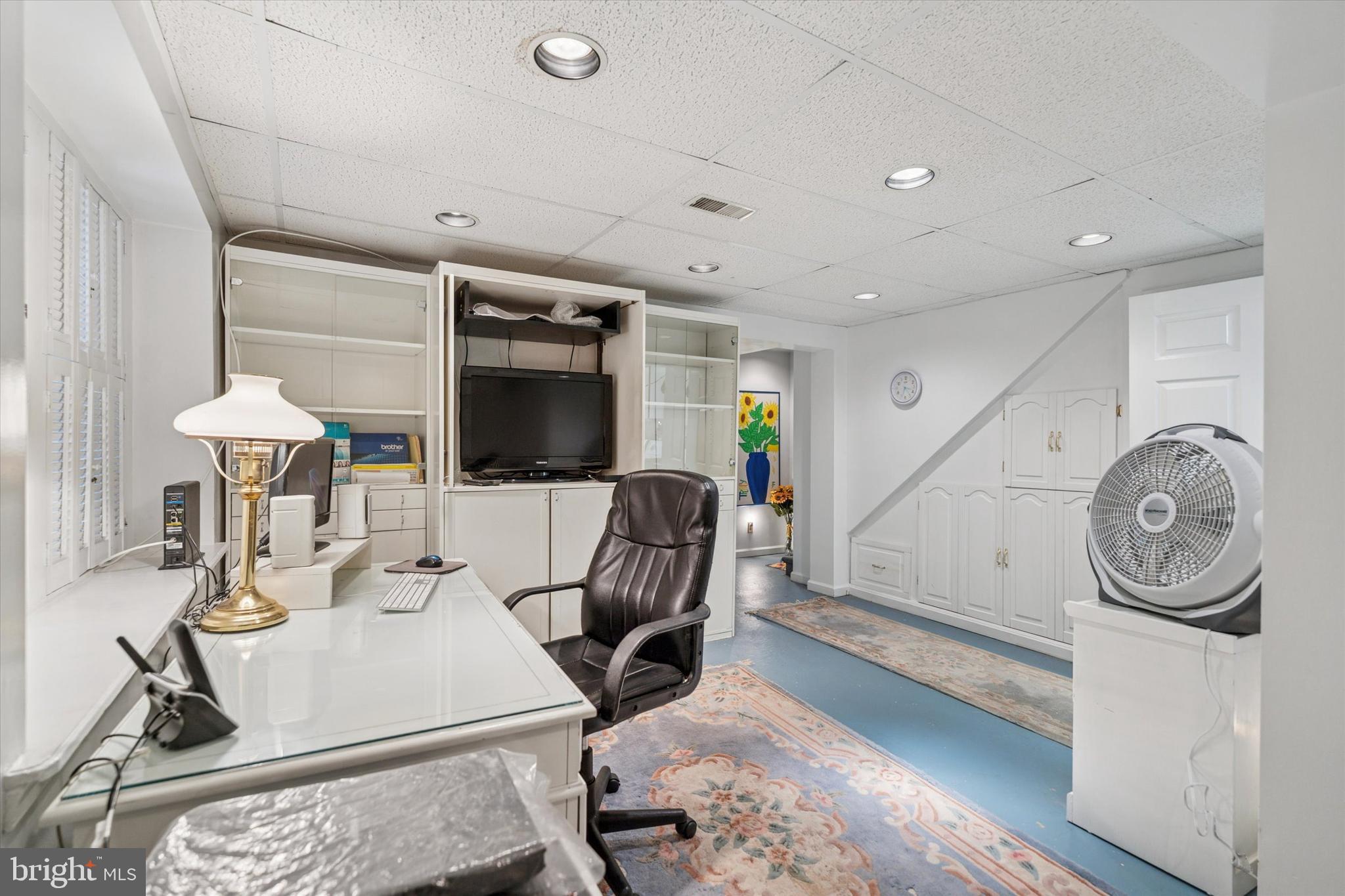 515 Conway Avenue Narberth, PA 19072 - Photo 22 of 27 a room with furniture a flat screen tv and a table