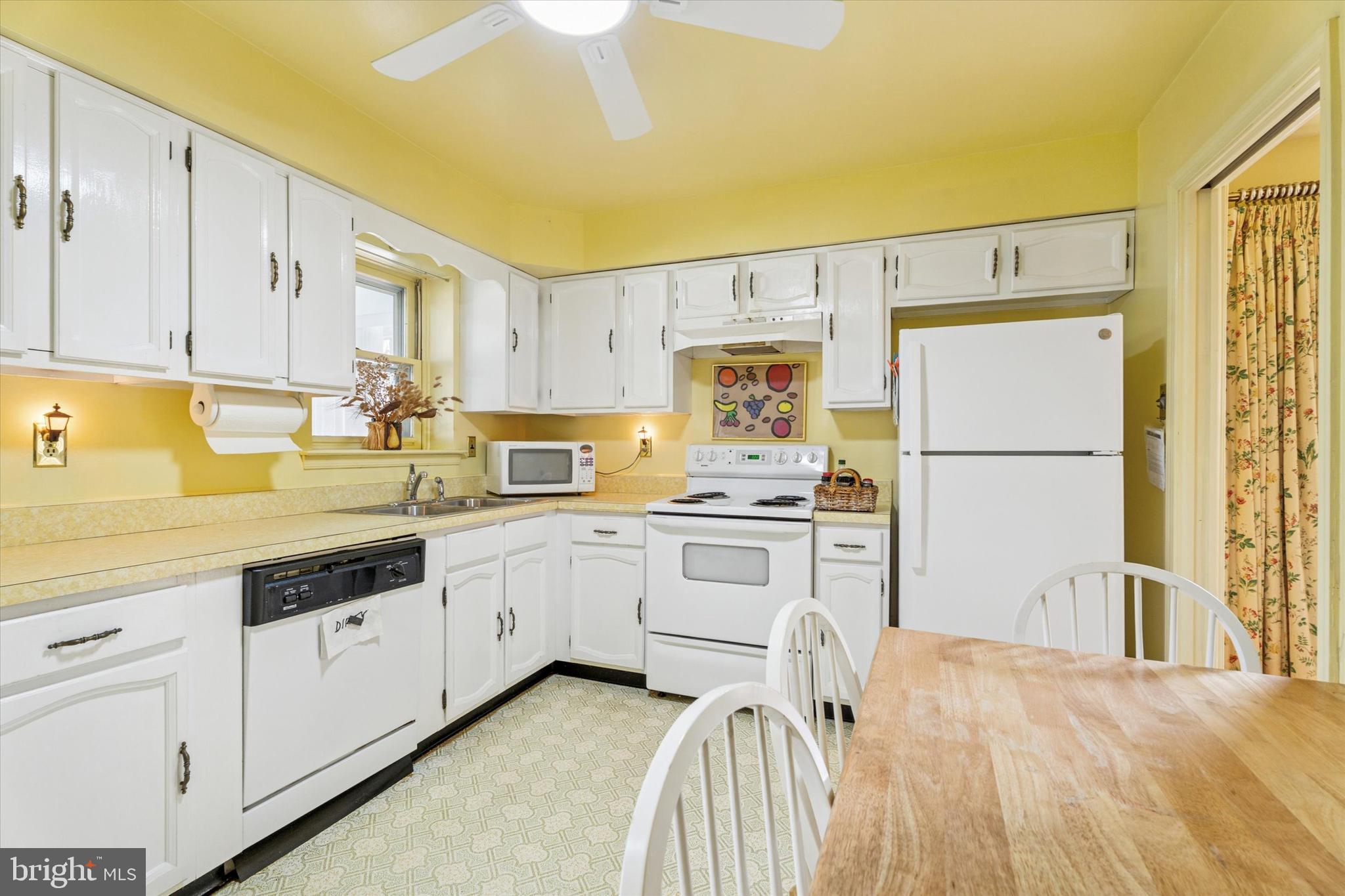 515 Conway Avenue Narberth, PA 19072 - Photo 9 of 27 a kitchen with granite countertop white cabinets and white appliances