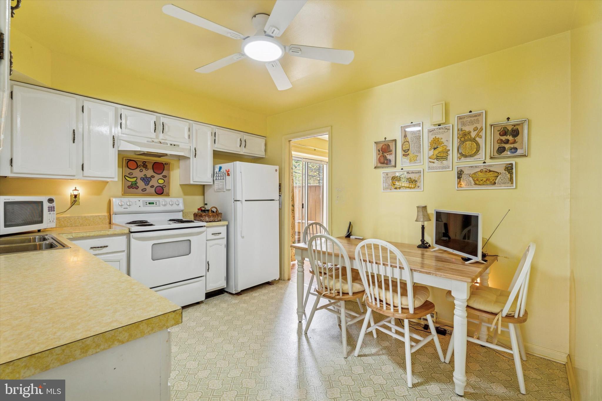 515 Conway Avenue Narberth, PA 19072 - Photo 10 of 27 a kitchen with stainless steel appliances a stove a sink island and chairs