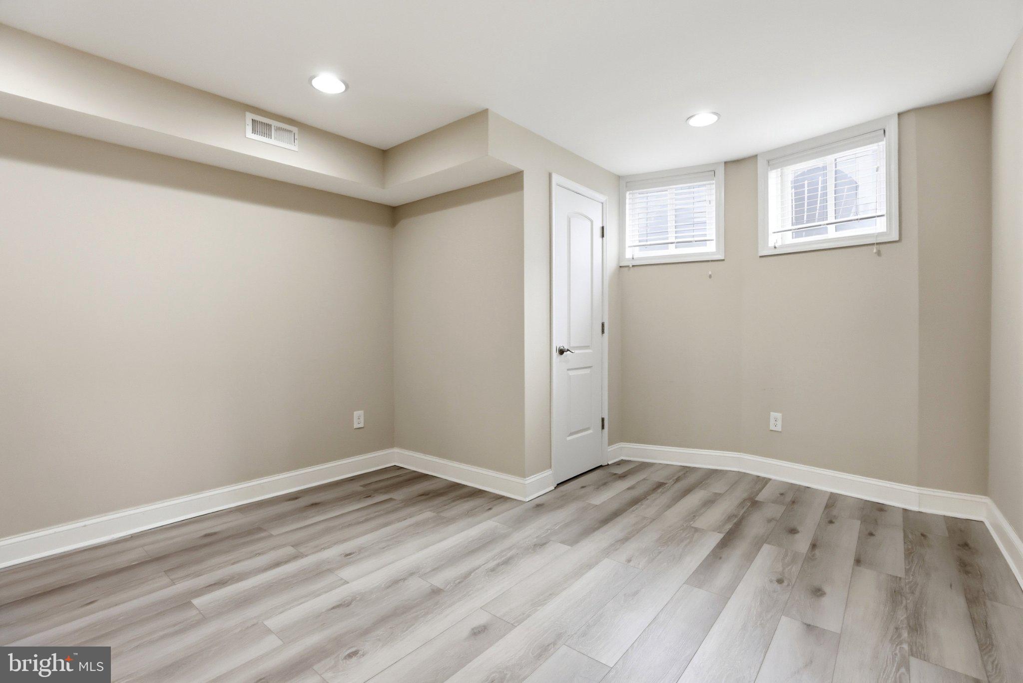 222 South Exeter Street Baltimore, MD 21202 - Photo 24 of 41 a view of room with window and hardwood floor