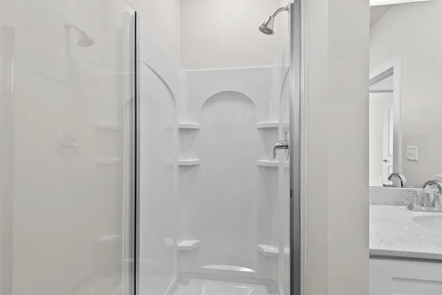 a bathroom with a sink and mirror