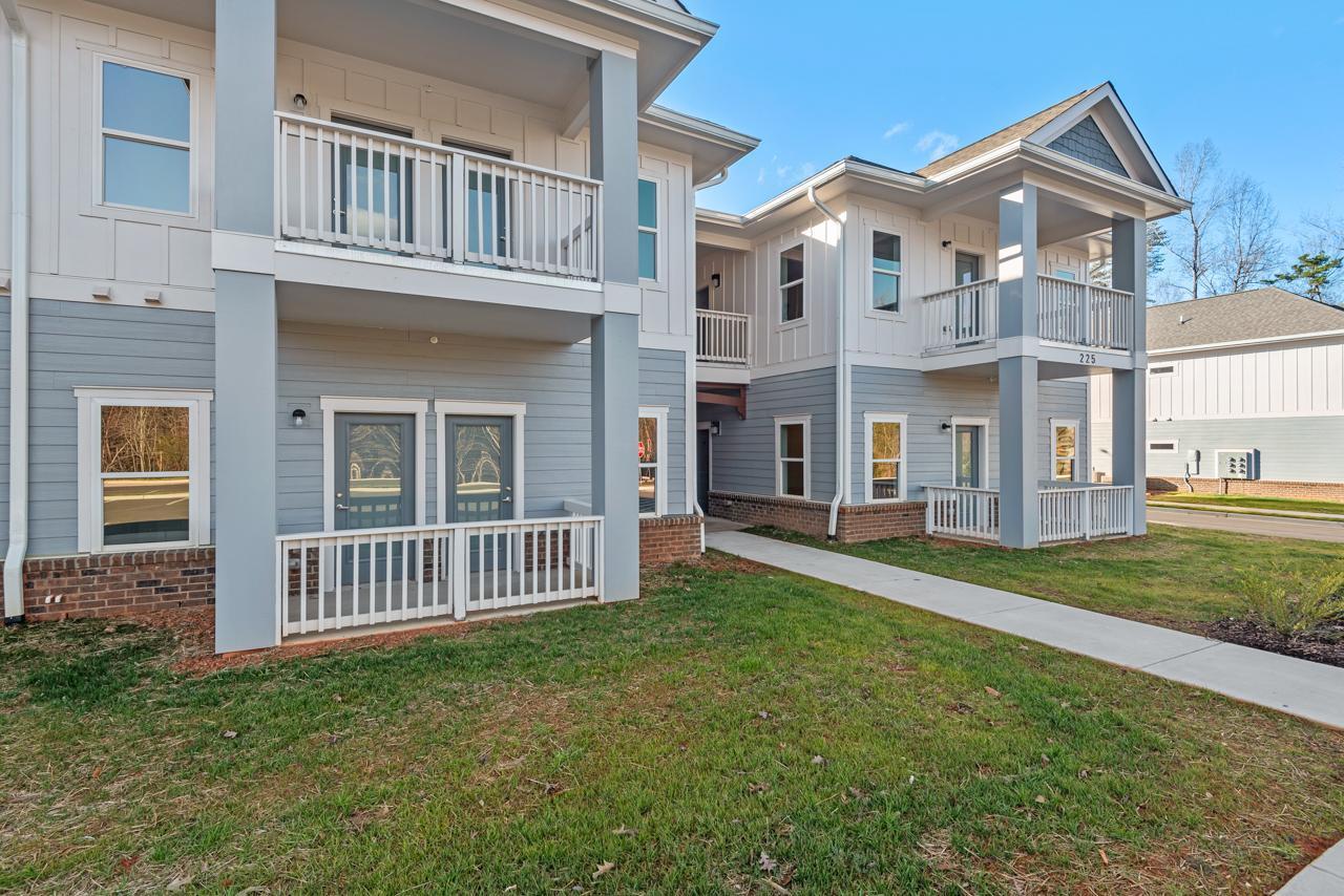 223 South Eleventh Street, Unit 103 Mebane, NC 27302 - Photo 2 of 41 front view of a house with a yard