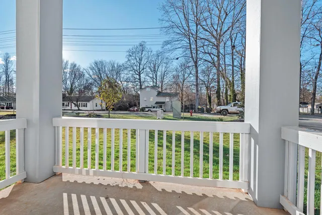 a view of a house with a small yard