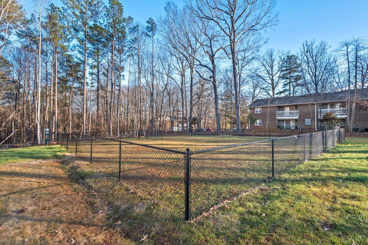 223 South Eleventh Street, Unit 103 Mebane, NC 27302 - Photo 35 of 41 a view of backyard with swimming pool and outdoor seating